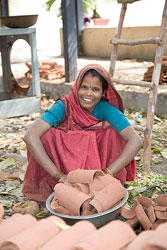 19B 6081   Indian laborer moving roof tiles, Delhi.  &copy; ADAMS / HANSEN STOCK PHOTOS