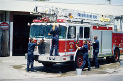 57-33-G    Multi ethnic crew washing fire truck, San Diego.  &copy; ADAMS / HANSEN STOCK PHOTOS