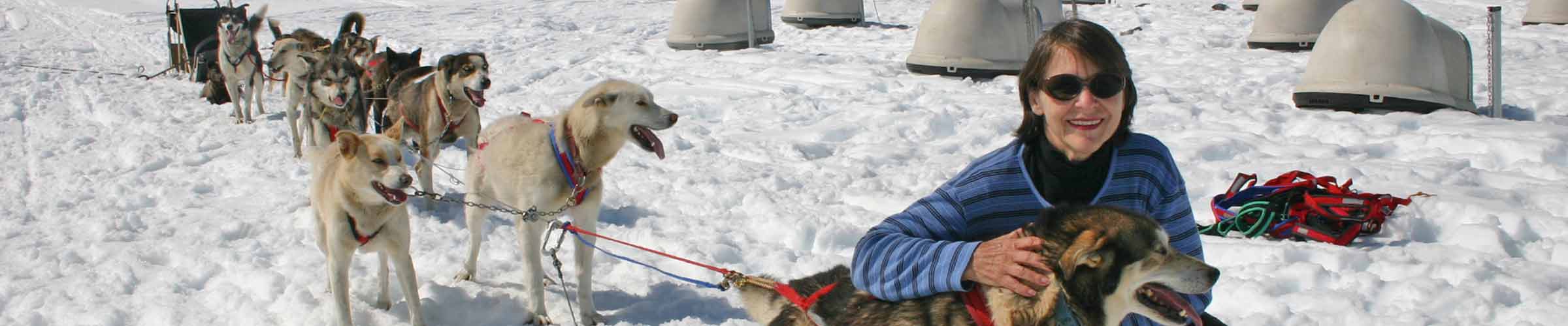 Elzabeth in Artic Circle with huskies and sled